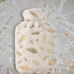 accessoire confort bouillotte plumes dorées