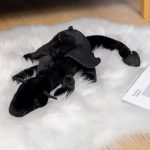 jouet en peluche dragon rose